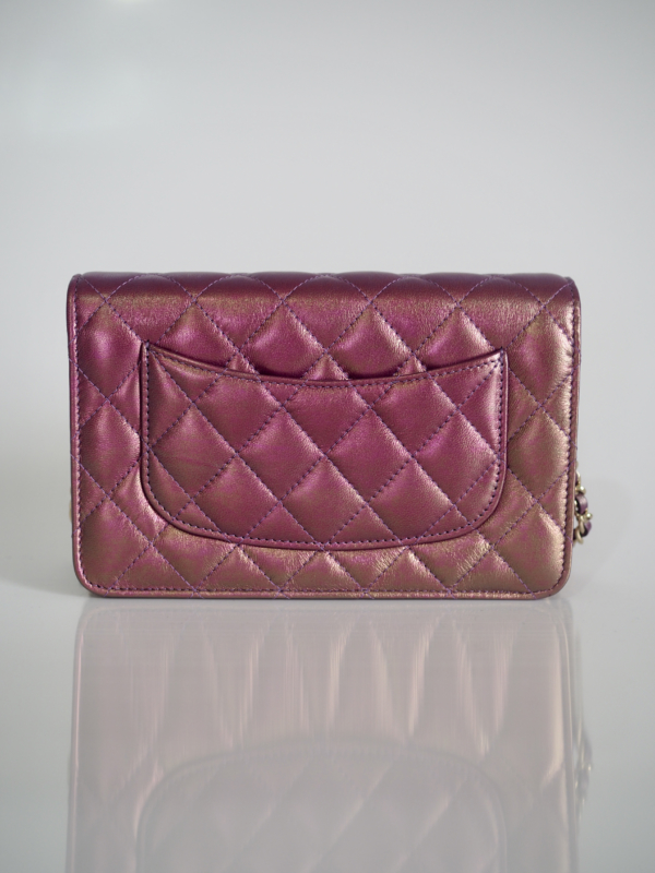 Chanel 20B purple iridescent lambskin woc with gold hardware.